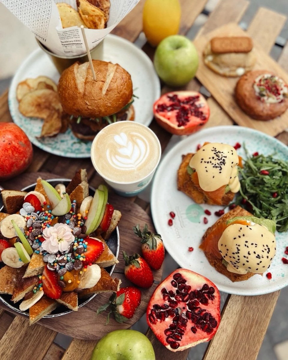 Brunch spread with eggs benedict and a flat white at Cookie Beacon