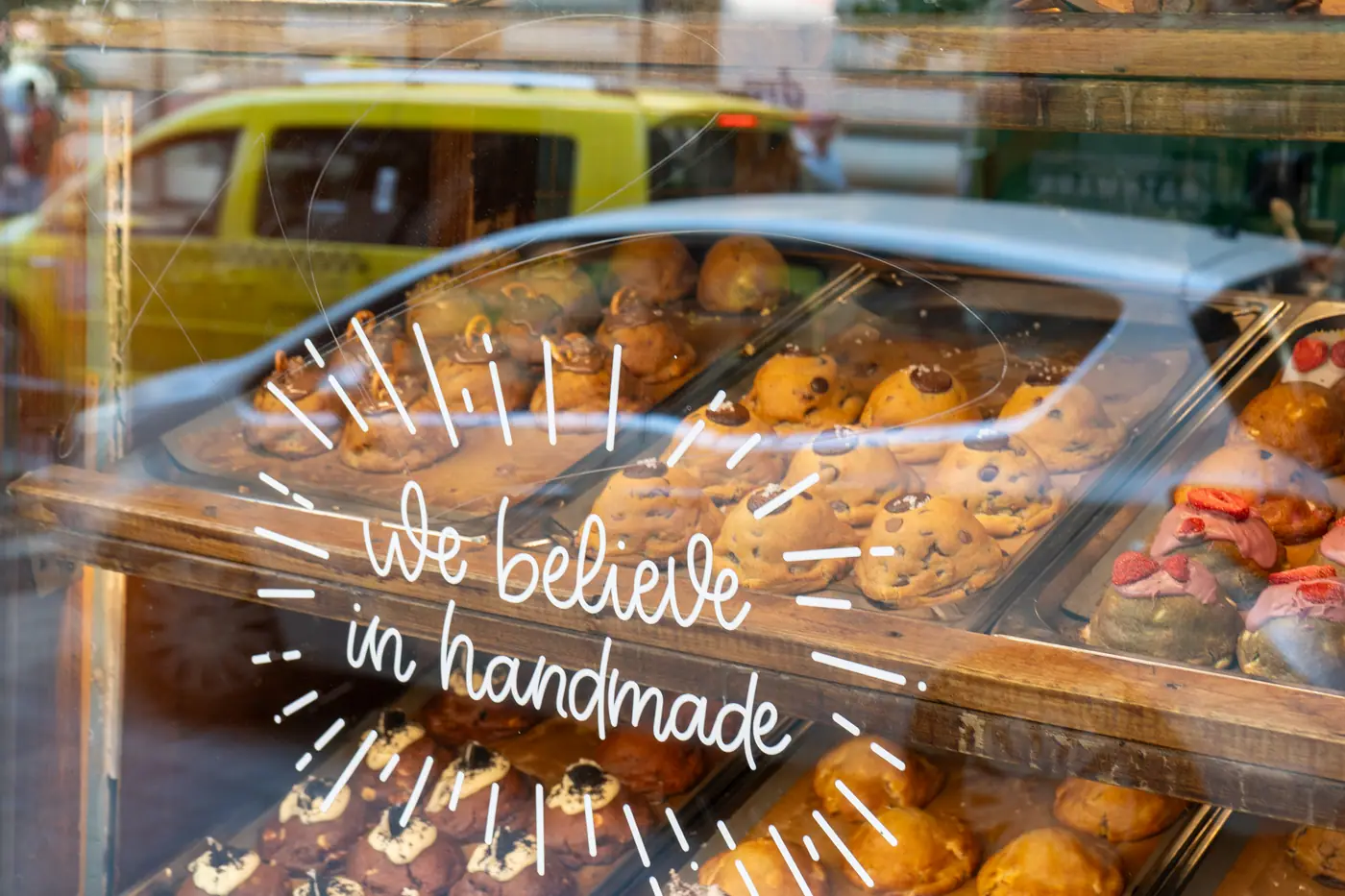 “We believe in handmade” window lettering over the chunky-cookie display