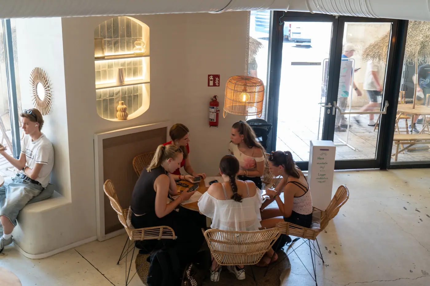 Friends sharing brunch at a round table at Cookie Beacon Ferenciek tere
