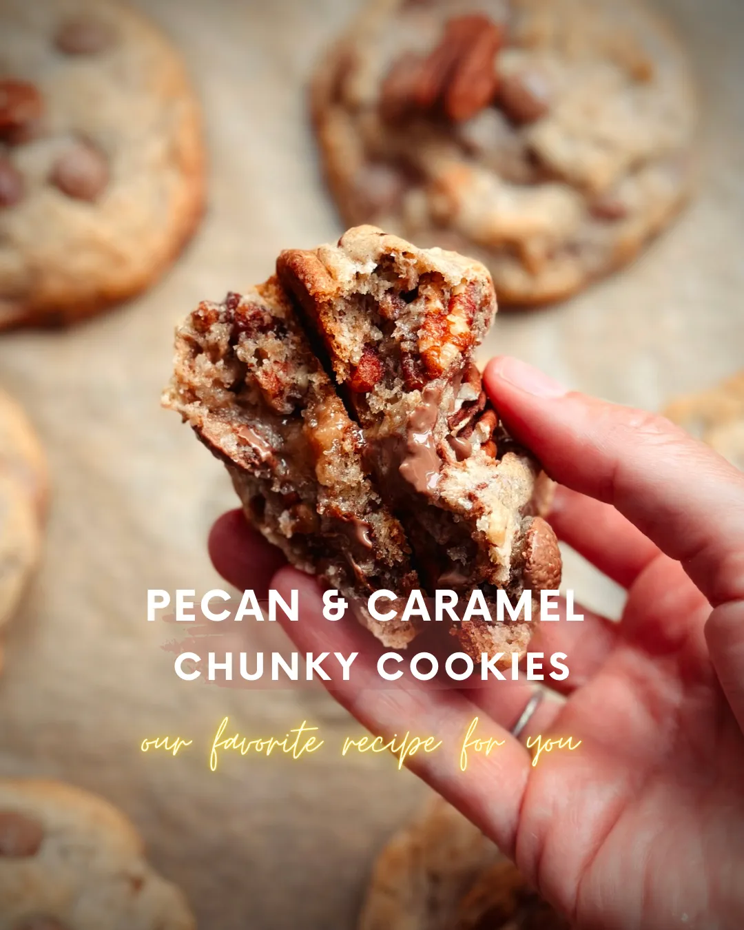 A hand holding a broken pecan caramel chunky cookie showing melted caramel, pecans and chocolate inside